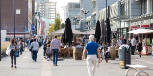 People in shopping street,without parking cars.